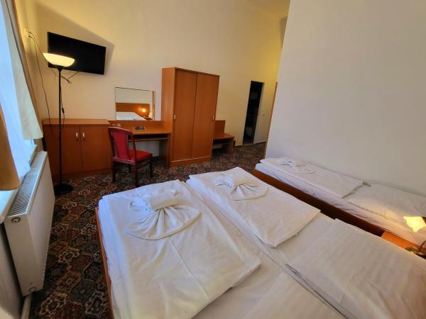 City-Inn : photo 1 de la chambre chambre triple