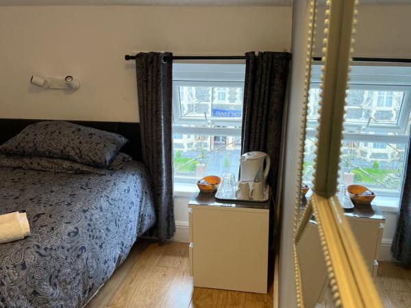 parklane guest house : photo 2 de la chambre chambre simple avec toilettes et douche communes