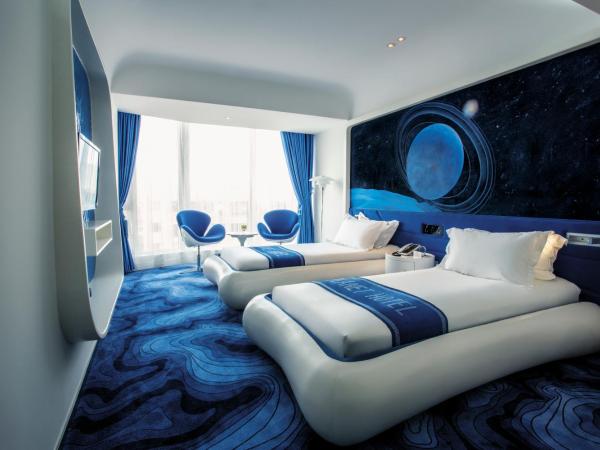 Guangzhou Planet Hotel : photo 1 de la chambre petite chambre double ou lits jumeaux