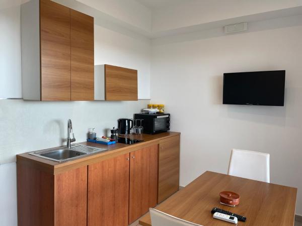 Don Vittorio Country Village : photo 1 de la chambre appartement avec balcon