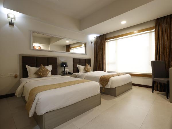 Aristocrat Hotel, New Town, Kolkata : photo 4 de la chambre chambre lits jumeaux deluxe