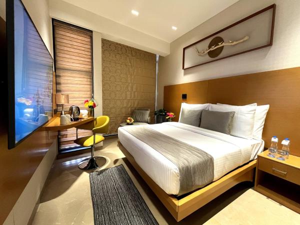 Morvee Hotels Alipore Kolkata : photo 6 de la chambre chambre supérieure lit queen-size