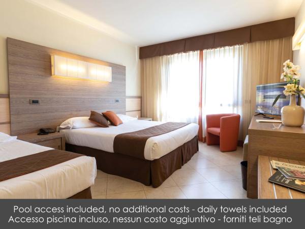 NilHotel Florence : photo 1 de la chambre chambre triple avec accès à la piscine