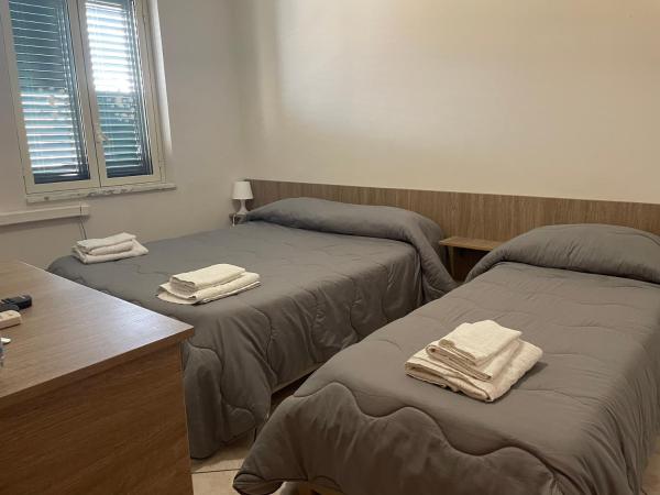 Airport Tourist's Home : photo 1 de la chambre chambre lits jumeaux