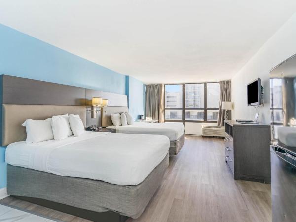 Sun N Sand Resort : photo 1 de la chambre hébergement premier avec 2 lits queen-size et fenêtre - vue sur océan