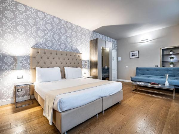 Martelli 6 Suite & Apartments : photo 1 de la chambre chambre triple supérieure