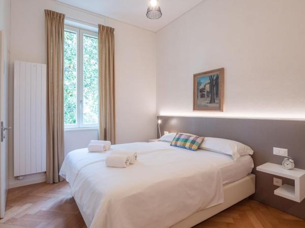 Villa by @ Home Hotel Locarno : photo 1 de la chambre chambre supérieure lit queen-size