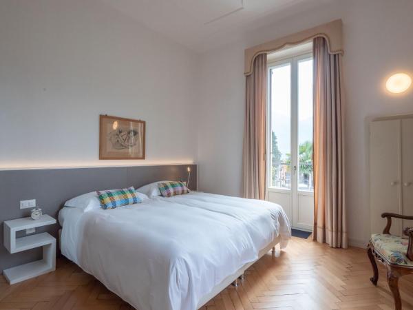 Villa by @ Home Hotel Locarno : photo 1 de la chambre suite de luxe avec balcon