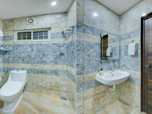 Treebo Love Shore Residency, Near Lakeshore Hospital : photo 10 de la chambre chambre double supérieure