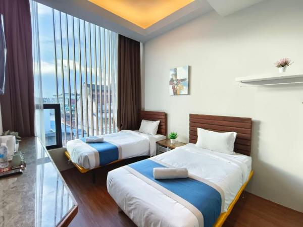 The Riverbank Hotel By MRVJ Business : photo 1 de la chambre chambre lits jumeaux deluxe