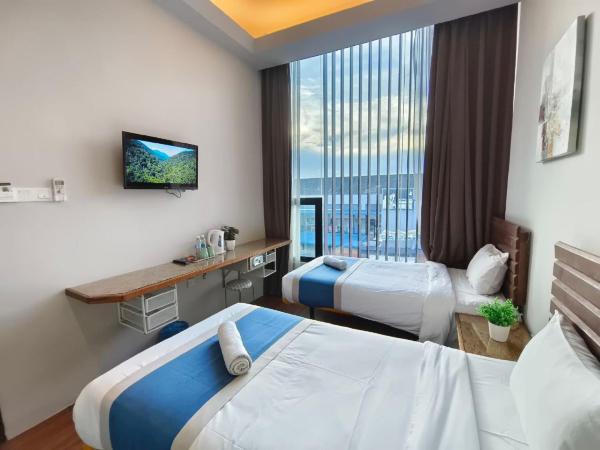 The Riverbank Hotel By MRVJ Business : photo 4 de la chambre chambre lits jumeaux deluxe