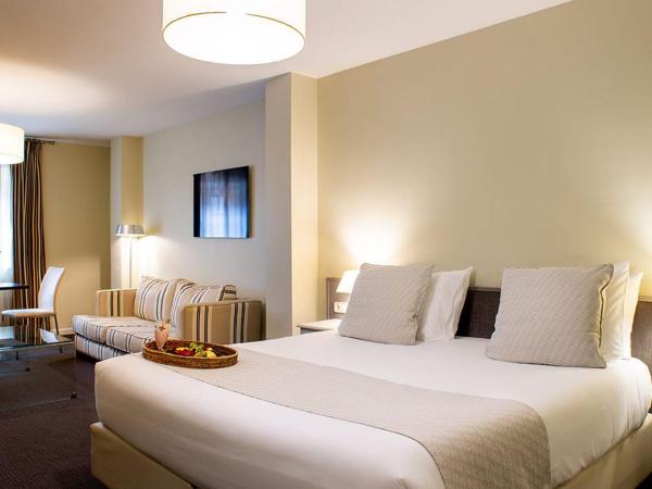 Ikonik Plaza Mercado : photo 2 de la chambre chambre double familiale