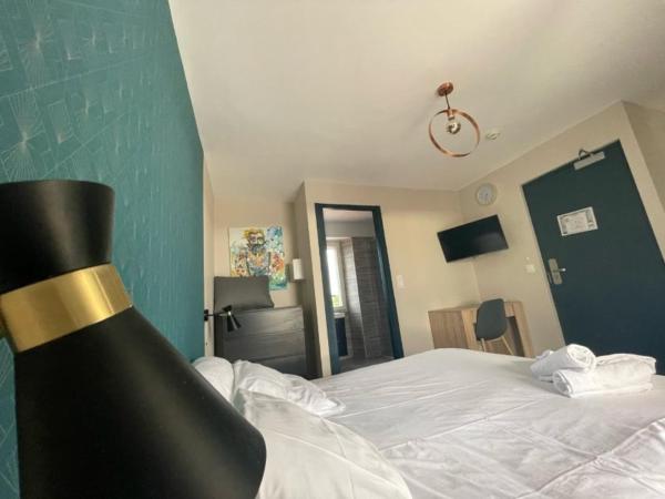 Appart'Hôtel Sous Les Pins : photo 2 de la chambre appartement avec balcon