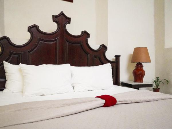 VILLA MERIDA BOUTIQUE HOTEL - Adults Only : photo 2 de la chambre chambre lit queen-size - vue sur jardin