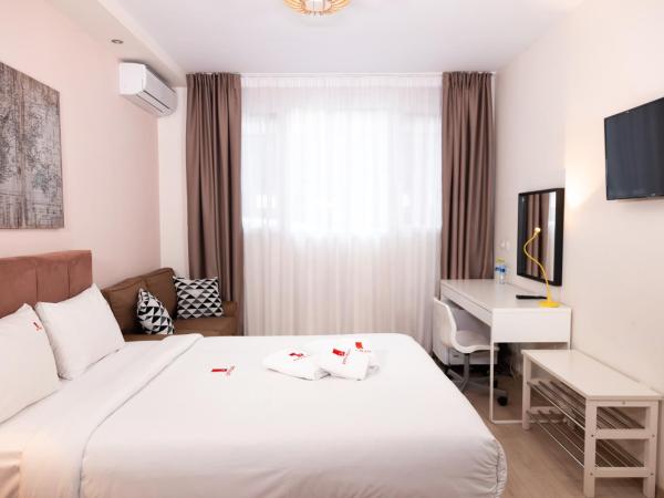 City Plaza Apartments & Rooms : photo 1 de la chambre chambre de rez-de-chaussée