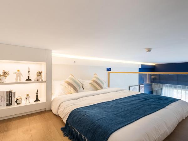 Livetour Hotel Pazhou Exhibition Center Guangzhou : photo 10 de la chambre chambre lits jumeaux supérieure avec balcon