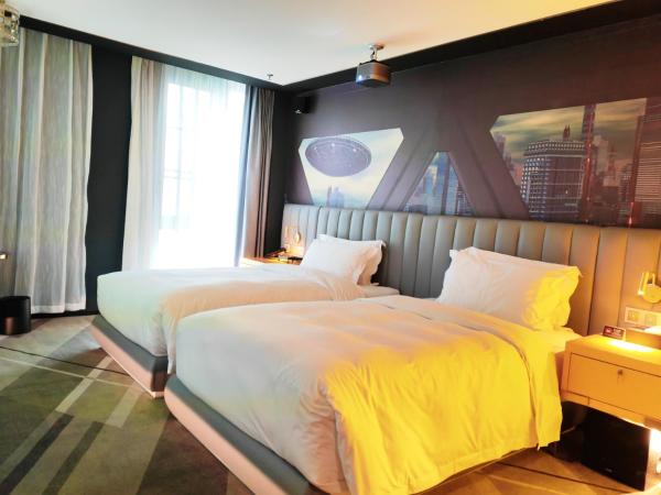 Movietel Shenzhen : photo 3 de la chambre comfortable movie room twin bed