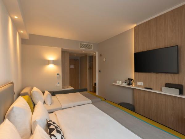 Holiday Inn Express Munich - City East, an IHG Hotel : photo 7 de la chambre chambre lit queen-size avec canapé-lit