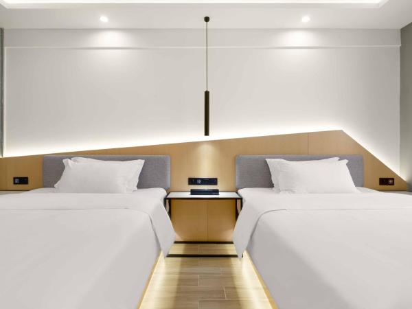 Weiming Hotel : photo 3 de la chambre yuexin twin room