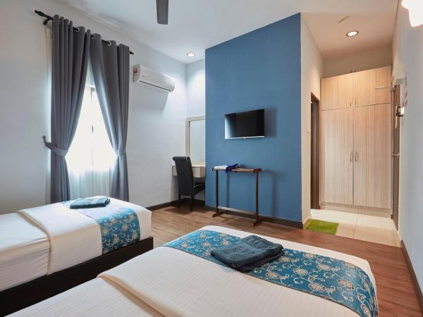 D' Qamar Guesthouse : photo 2 de la chambre chambre lits jumeaux