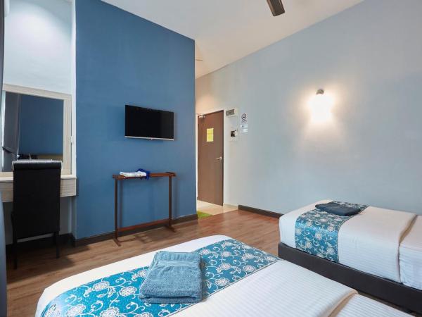 D' Qamar Guesthouse : photo 3 de la chambre chambre lits jumeaux