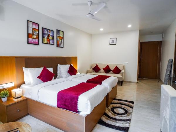 Saltstayz Executive Studio Apartment : photo 5 de la chambre chambre lits jumeaux avec balcon