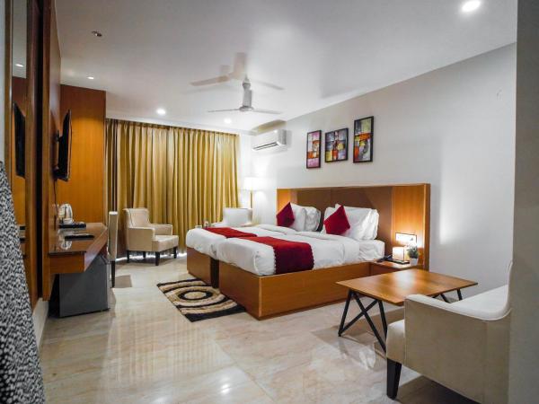 Saltstayz Executive Studio Apartment : photo 4 de la chambre chambre lits jumeaux avec balcon