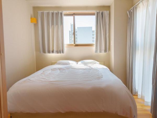 DC桜の苑501洋室双人床 : photo 5 de la chambre chambre double avec balcon