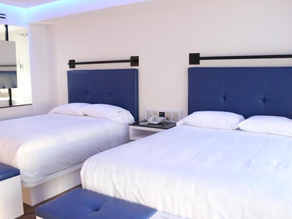 WeEnjoy Hotels Grand Prix Aeropuerto CDMX : photo 3 de la chambre chambre quadruple classique