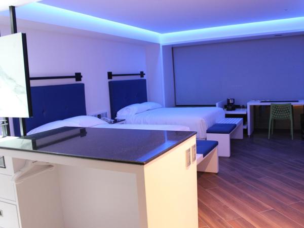 WeEnjoy Hotels Grand Prix Aeropuerto CDMX : photo 3 de la chambre chambre double avec 2 lits doubles