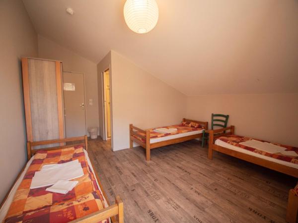 Chalet Annapurna : photo 1 de la chambre chambre triple avec salle de bains privative