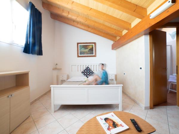 Casa Merano Residence & Ristorante Bibione Centro : photo 1 de la chambre chambre familiale mansardée