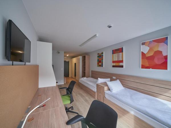 Apartamenty Collegia : photo 4 de la chambre chambre lits jumeaux standard
