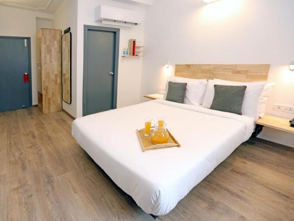 OYO Townhouse 17 Huda City Center Near Leisure Valley Park : photo 6 de la chambre chambre triple classique