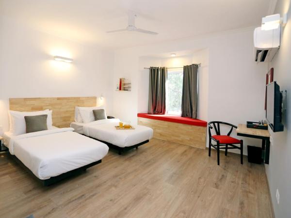 OYO Townhouse 17 Huda City Center Near Leisure Valley Park : photo 4 de la chambre chambre triple classique