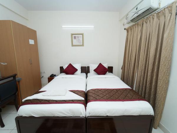 The Altruist Business Stays Bellandur-1 : photo 3 de la chambre chambre lits jumeaux deluxe