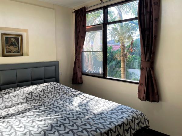Golf-Sea-City Guest House : photo 2 de la chambre chambre lit queen-size avec balcon