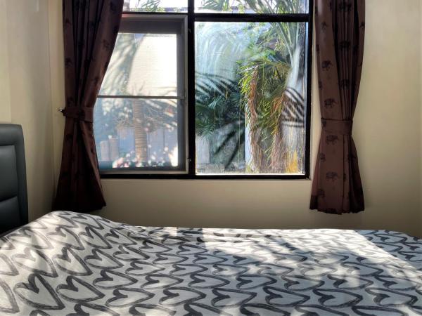 Golf-Sea-City Guest House : photo 1 de la chambre chambre lit queen-size avec balcon