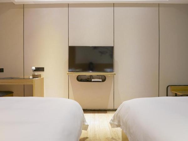 Paco Hotel Tiyuxilu Metro Guangzhou-Free Shuttle Bus for Canton Fair : photo 2 de la chambre chambre lits jumeaux supérieure sans fenêtre