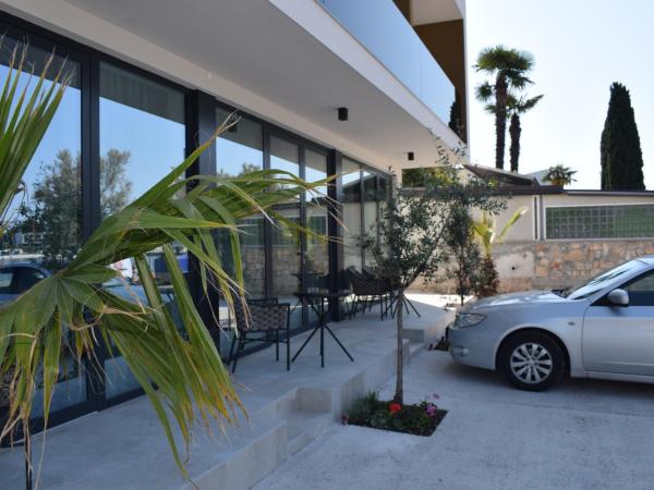 Maresole Beachfront Residence : photo 1 de la chambre chambre triple