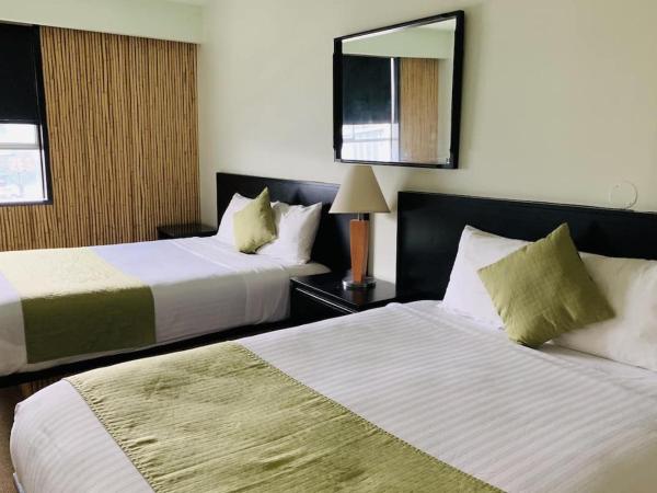 Hotel at the Waldorf : photo 1 de la chambre chambre avec 2 grands lits queen-size