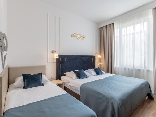 Annex building of Art Hotel : photo 6 de la chambre chambre triple
