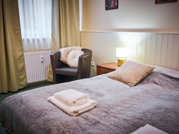 Penzion Weber : photo 1 de la chambre chambre triple avec balcon
