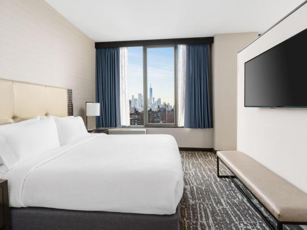 Fairfield Inn & Suites by Marriott New York Midtown Manhattan/Penn Station : photo 3 de la chambre suite lit king-size avec canapé-lit