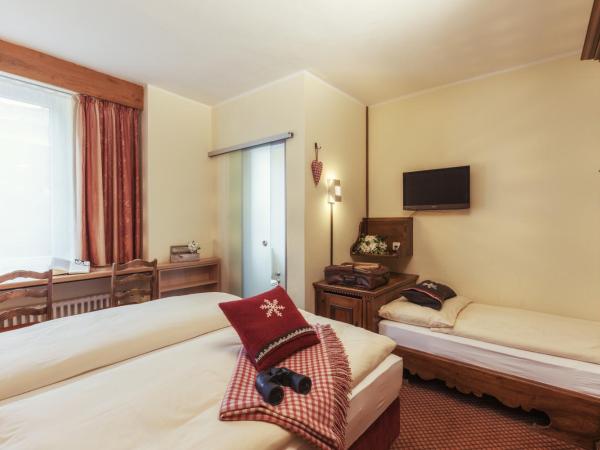 Le Petit CHARME-INN : photo 2 de la chambre chambre triple