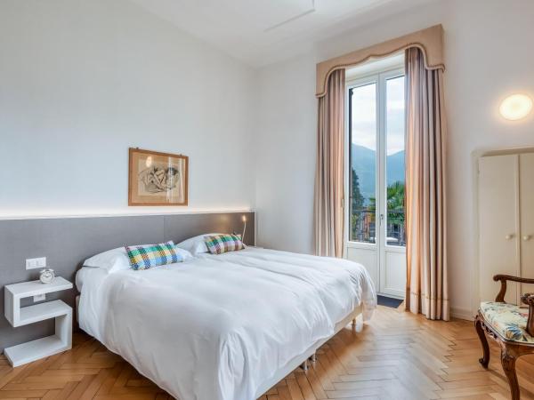 Villa by @ Home Hotel Locarno : photo 4 de la chambre suite de luxe avec balcon