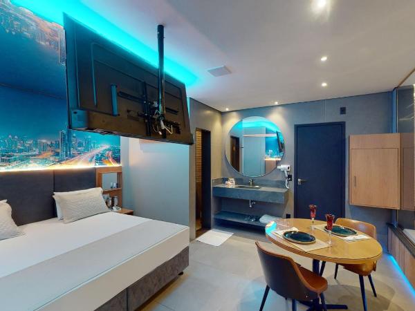 Motel DUBAI BH : photo 1 de la chambre suite avec piscine privée