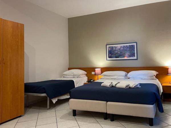 Hotel Leopolda : photo 1 de la chambre chambre triple