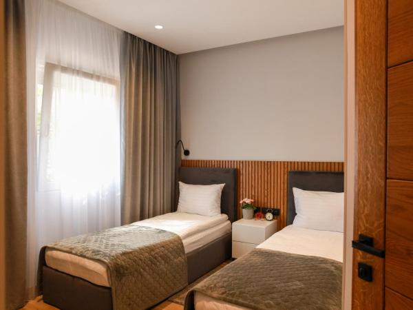 Apart-hotel Dream : photo 7 de la chambre chambre lits jumeaux avec salle de bains