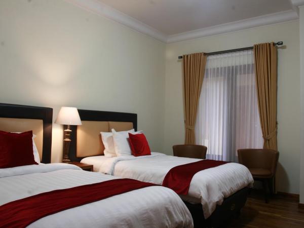 Griya Wijilan Syariah : photo 1 de la chambre chambre lits jumeaux deluxe